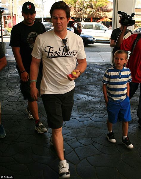 Mark Wahlberg Shows Off His Muscles As He Takes Eldest Son Michael To Lunch Daily Mail Online