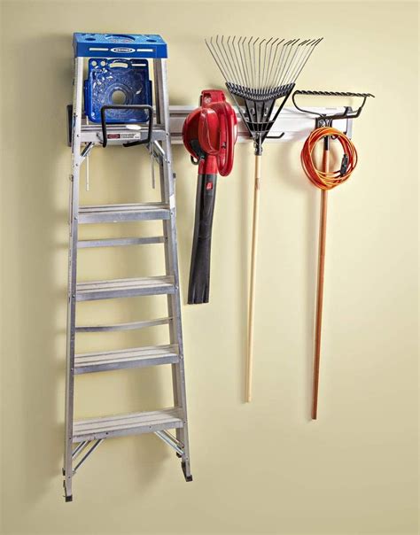 How To Hang A Ladder In The Garage Garage Wall Storage Pegboard