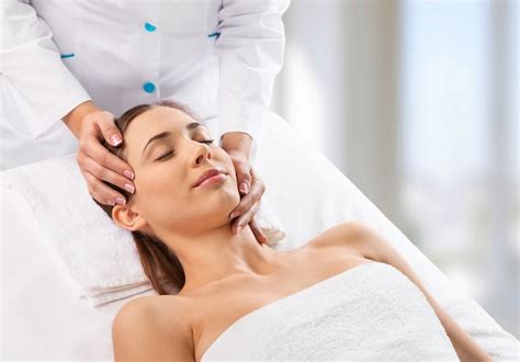 Premium Photo Beautiful Young Woman Enjoying Head Massage In Spa Center
