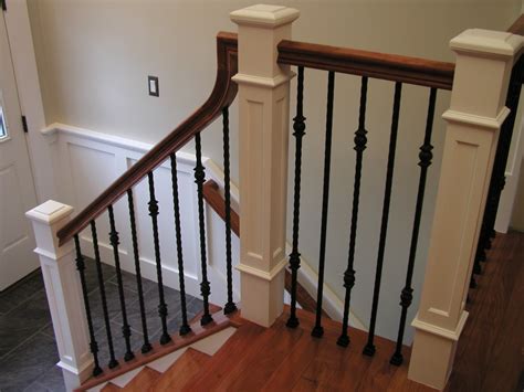 So, we decided to stain the banister and newel posts (and the wood that runs along the base of the spindles) and to paint each of the spindles a creamy white color. Lomonaco's Iron Concepts & Home Decor: New Railing and ...