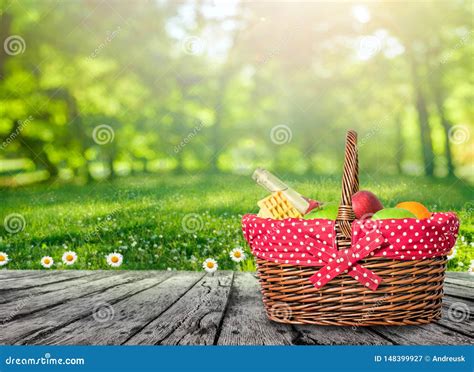 A Wooden Picnic Table With Picnic Basket Stock Image Image Of