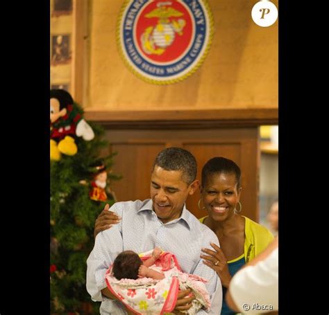 Barack et Michelle Obama des bébés dans les bras craquent
