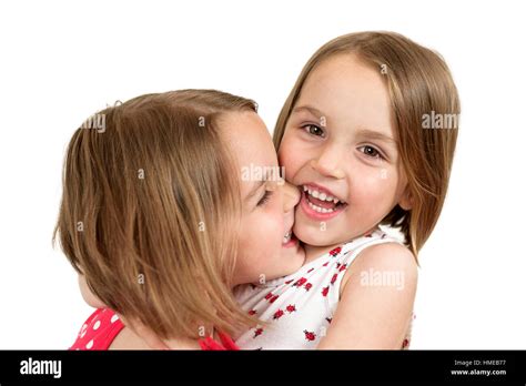 Two Smiling Twin Sisters Hugging Hi Res Stock Photography And Images