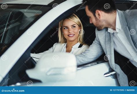 Handsome Salesman At Car Dealership Selling Vehichles Stock Image