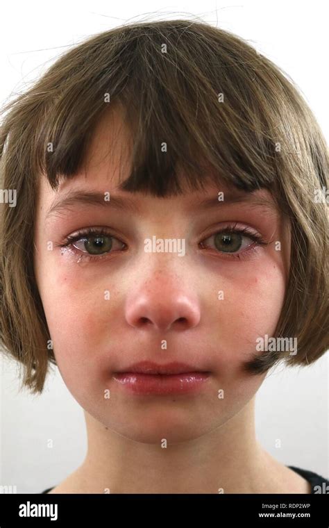 Portrait Of An Upset Defiant Little Girl With Tears Of Frustration In