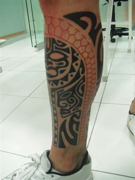 Black and red tribal lion tattoo. Red and black sun tattoo on leg - | TattooMagz › Tattoo ...