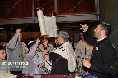 Bar Mitzvah Jewish Coming Of Age Ritual Men Holding Up Torah Scroll