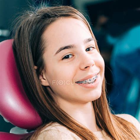 Portrait Of Girl Smiling With Dental Braces — Odontology Teeth