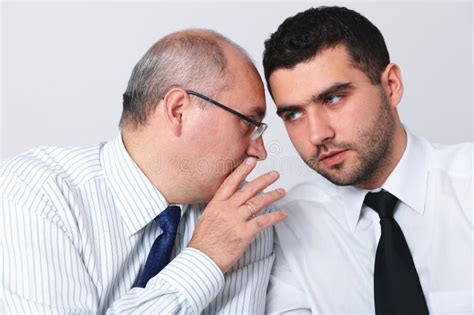Mature Businessman Whisper Something To Colleague Stock Photo Image