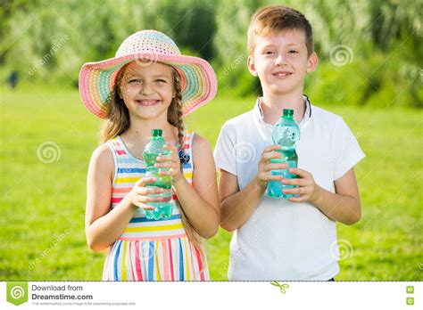 Two Kids Drinking Water Stock Photo Image Of Bottle 80255728
