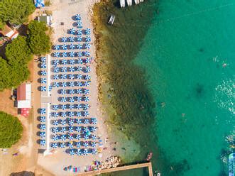 Aerial View Of People Enjoying The Beach At Alba Chiara Medulin