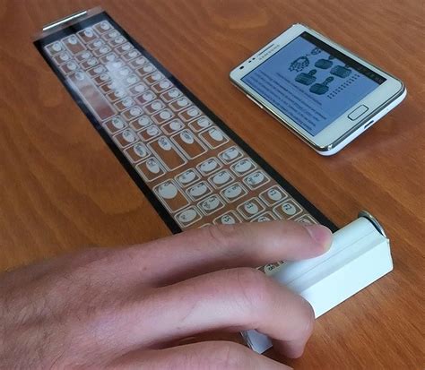 Qii Wireless Smartphone Keyboard Rolls Up Into A Film
