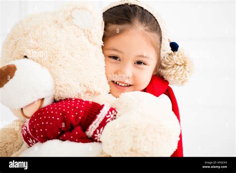 Happy Little Girl Holding Teddy Bear Stock Photo Alamy