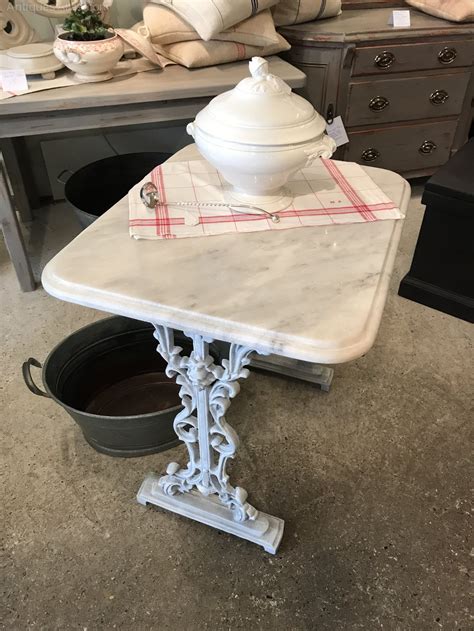 For a more affordable take on the tulip silhouette, this dining table is a steal at $550. Victorian Cast Iron Marble Topped Table. - Antiques Atlas