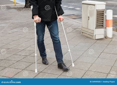 Man Trying To Walk Using Crutches Stock Image Image Of Crutch