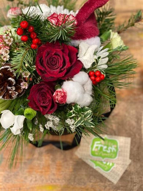 Smile Of Santa Christmas Arrangement In A Hat Box Buy In Vancouver