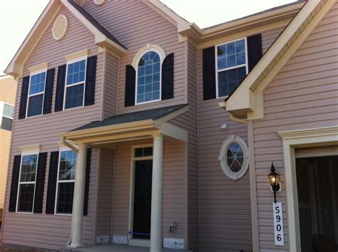 After removal, replace your existing siding with brick veneers or another material. Building with Ryan Homes: Pink siding?