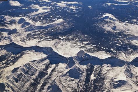 Aerial View Of Topographical Rocky Mountain Landscapes On Flight Over