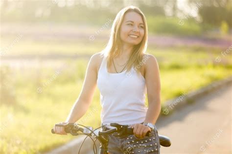 Blonde Girl Riding A Bike Photo Free Download