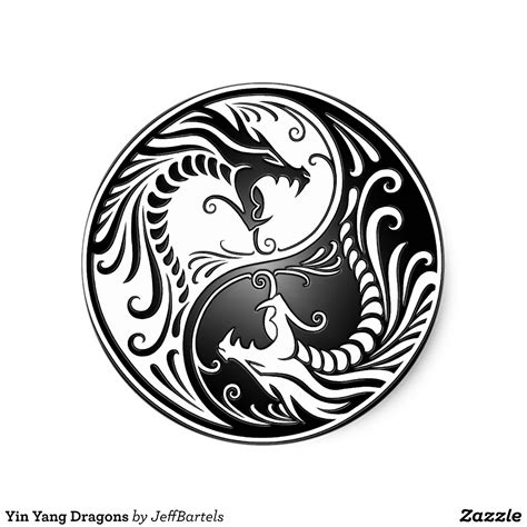 The Yin Yang Symbol In Black And White With Swirls On Its Side