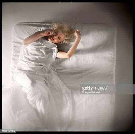 Portrait Of American Actress Marilyn Monroe As She Lies On A Bed