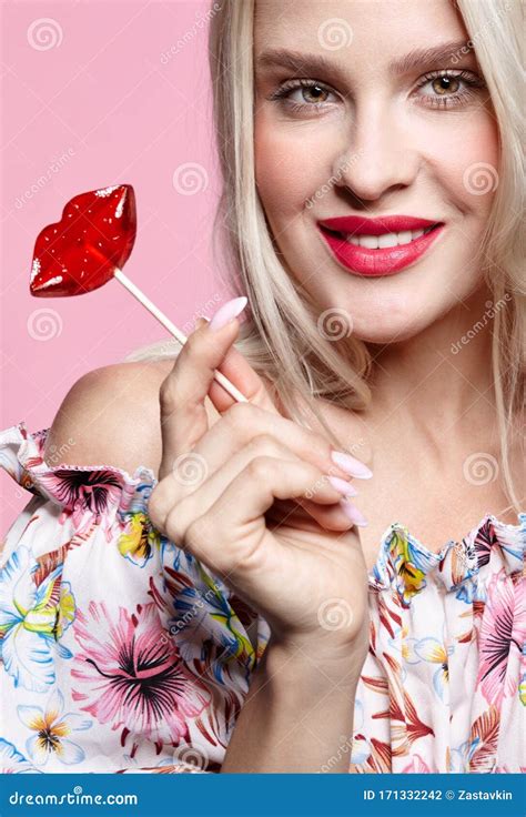 Portrait Of Blonde Happy Smiling Woman With Candy In Hand Red Female