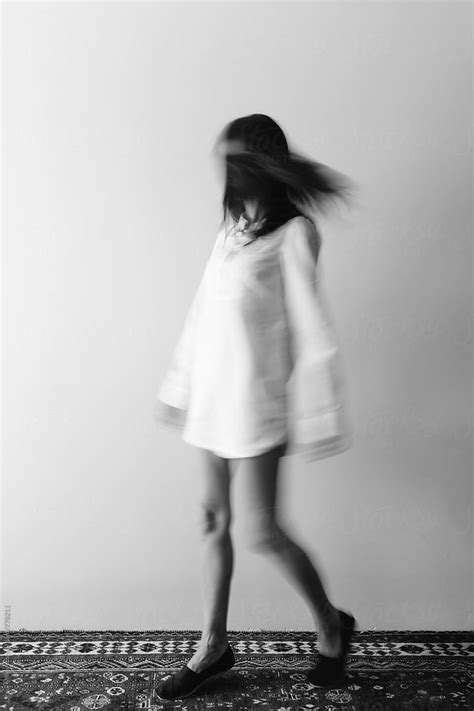 Black And White Movement Shot Of Woman Wearing A Long Shirt By