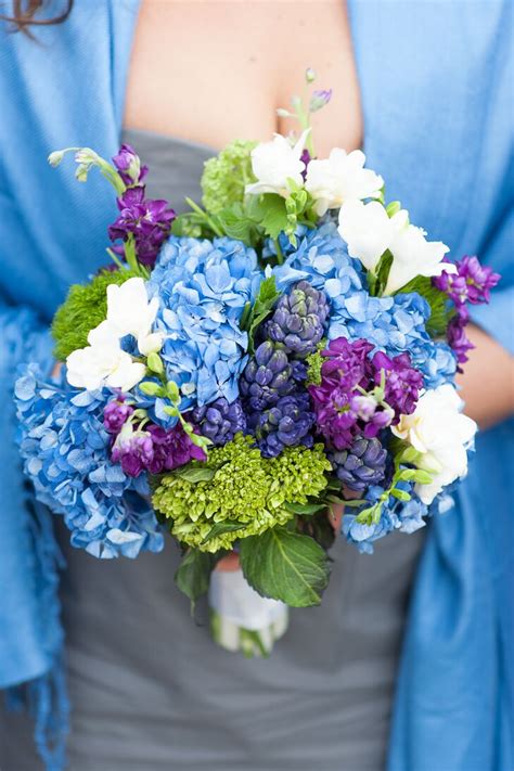 A bridal bouquet on a purple wedding doesn't necessarily have to be monotone. Blue, Purple and White Bridesmaid Bouquet