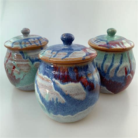 S Jars Set Different Coloured Lids £60 Canterbury Pottery