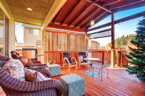 You can mix and match for an eclectic feel. Exterior Covered Patio With Fireplace And Furniture. Stock ...