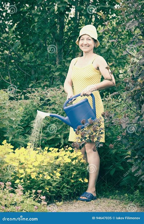 Woman Watering Flowers Stock Image Image Of Rural Nature 94647035