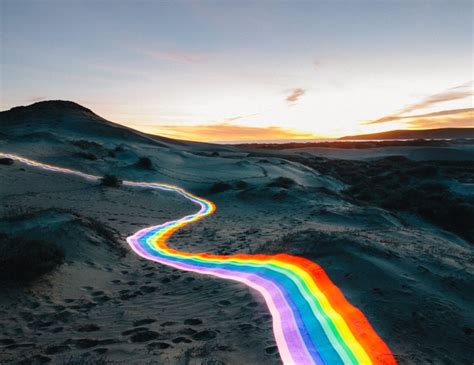 Vivid Rainbow Roads Trace Illuminated Pathways Across Forests And