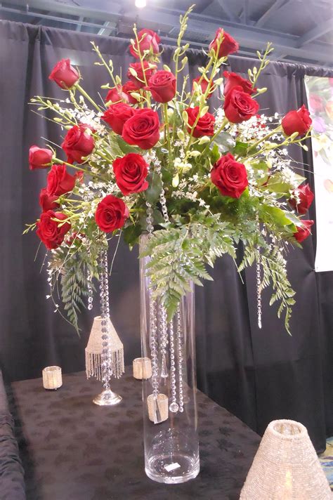 Red Rose Arrangement On A Tall Glass Vase With Hanging Crystals