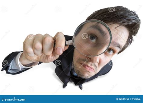 Young Businessman Is Looking Through Magnifying Glass Isolated On