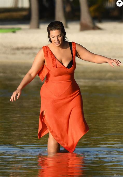 Exclusive Plus Size Model Ashley Graham Is Seen Posing On The Beach In A Black Bikini And Red