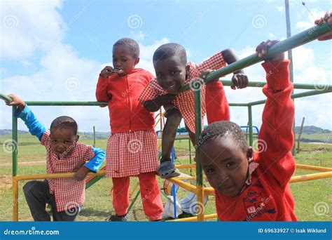 Group Of African Children Playing Outside In A Playground Swaziland