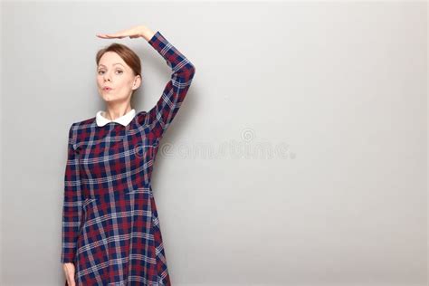 Girl Is Holding Hand Above Head And Measuring Her Height Stock Image Image Of Caucasian