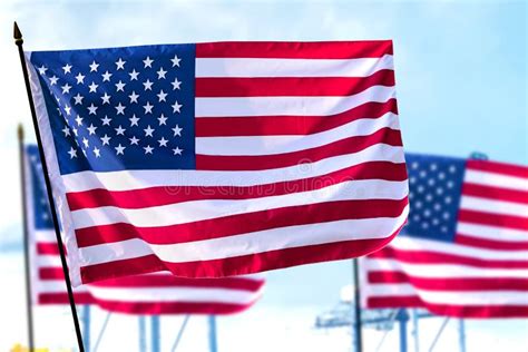 The United States Of America Flags Waving In The Air Stock Image