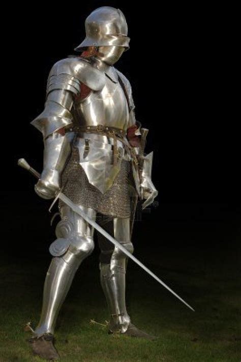 Medieval Knight In Shining Armour Of The 15th Century Standing