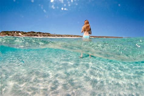 Teenage Girl Standing In Shallow Clear Water Of The Ningaloo Coast In Western Australia Del