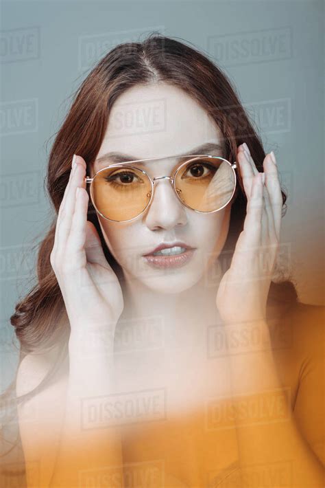 Nude Girl Posing In Yellow Sunglasses Isolated On Grey Stock Photo Dissolve