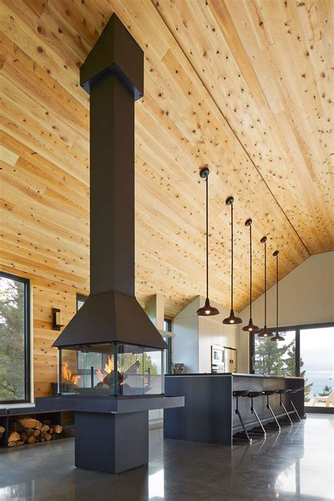 You will need a sloped ceiling pendant lights are another common kind of lighting used in vaulted ceiling lighting. Expansive Quebec Residence Charms With Inviting Warmth Of Wood