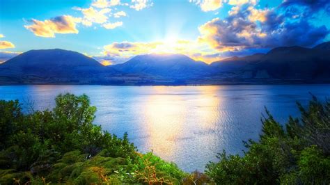 Relaxing Landscape With Water Mountains And Sunlight