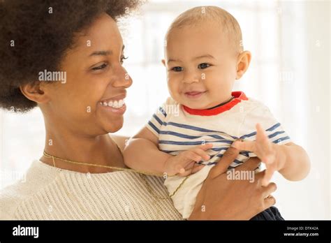 Mother Holding Baby Boy Stock Photo Alamy