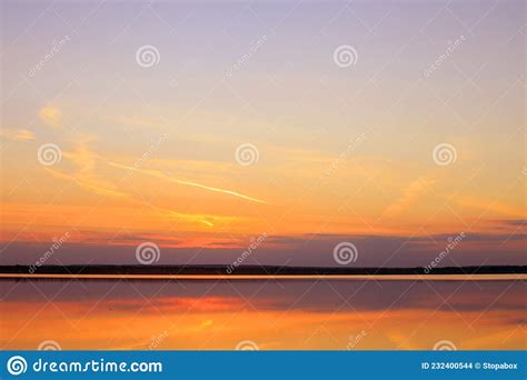 Reflection Of A Beautiful Sunset Over The Water Stock Photo Image Of