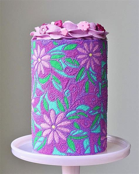 Colorful Hand Decorated Cakes Look Like They Are Completely Covered In