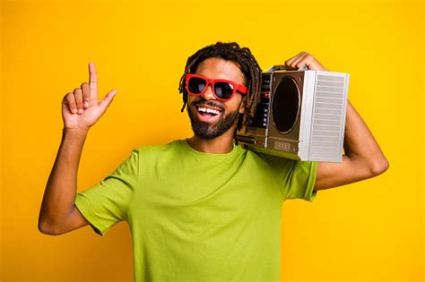 Photo Of Young Cheerful Happy Smile Man Hold Boombox Enjoy Music Show