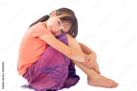 Girl Hugging Knees To Chest Stock Photo Adobe Stock