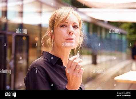 Blond Female Smoking Cigarette Hi Res Stock Photography And Images Alamy