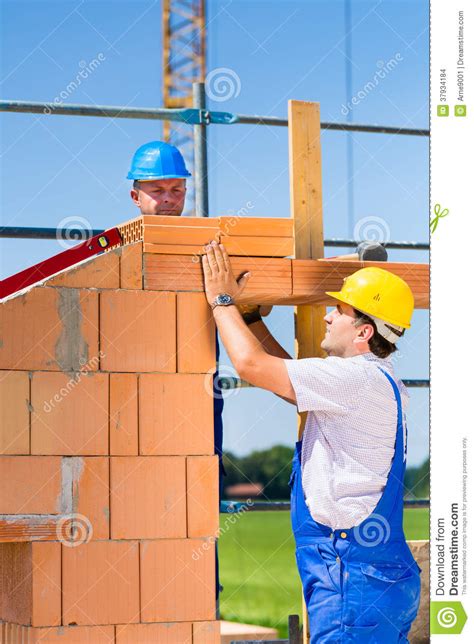 Bricklayer Or Builders On Construction Site Working Stock Photo Image
